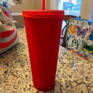 red studded starbucks cup